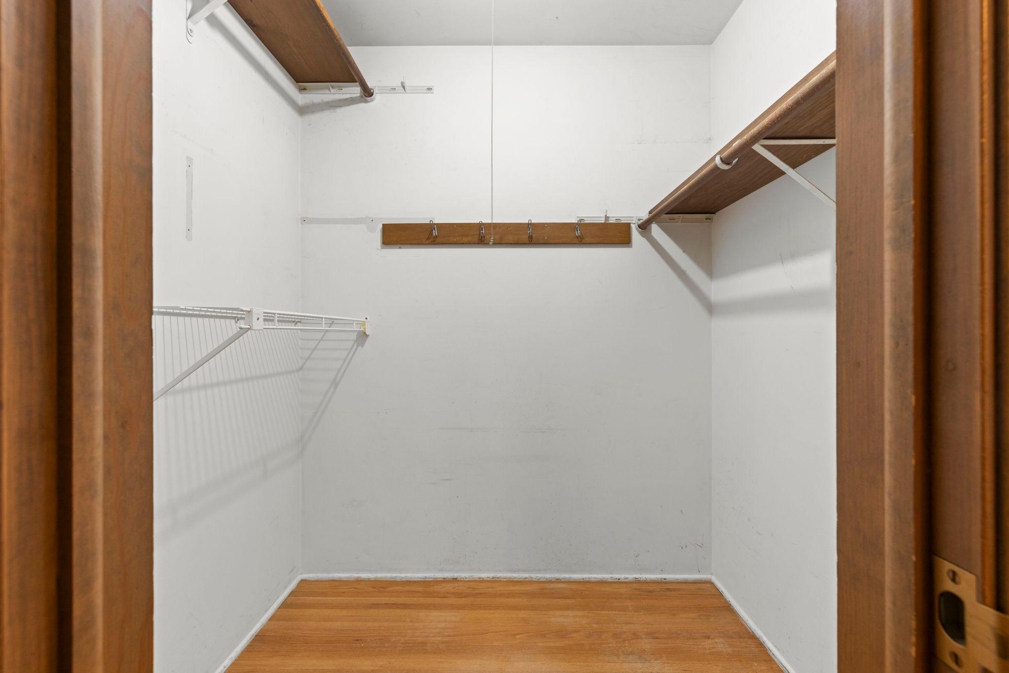 Primary bedroom walk-in closet