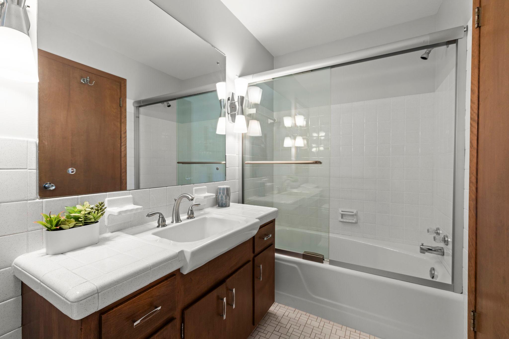 Main floor full bath with mid century tile and fixtures