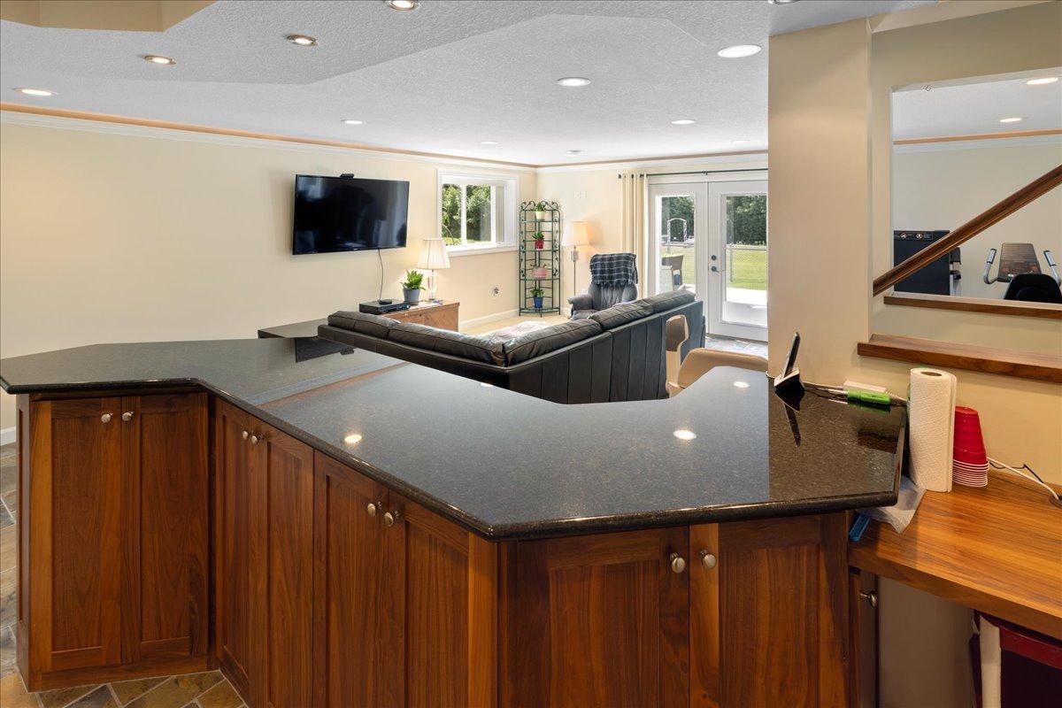 Custom cabinets open to the full family room