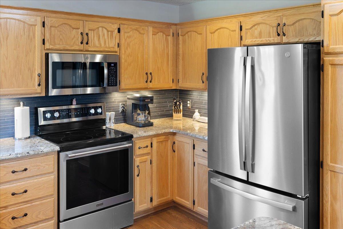 Stainless Steel appliances including updated refrigerator