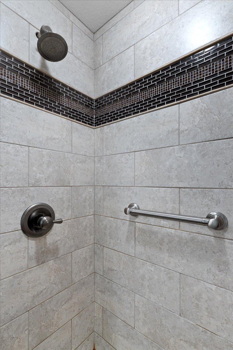 Shower stall with handy grab bars too