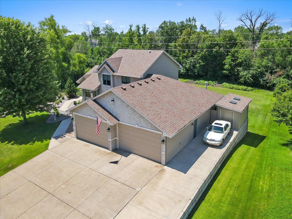 Freshened Concrete Driveway with Ample Parking