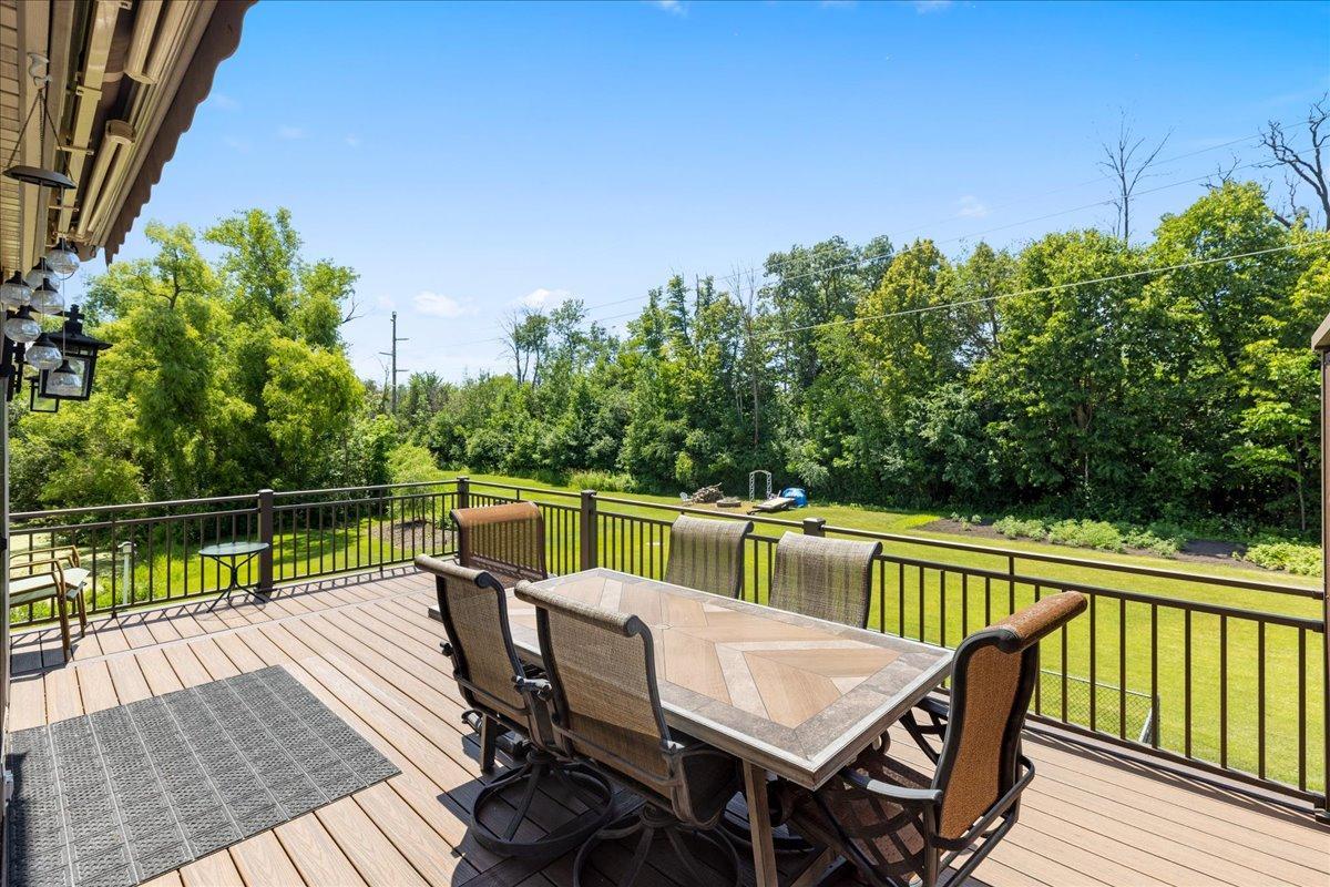 Large maintenance free decking and railing with retractable awning