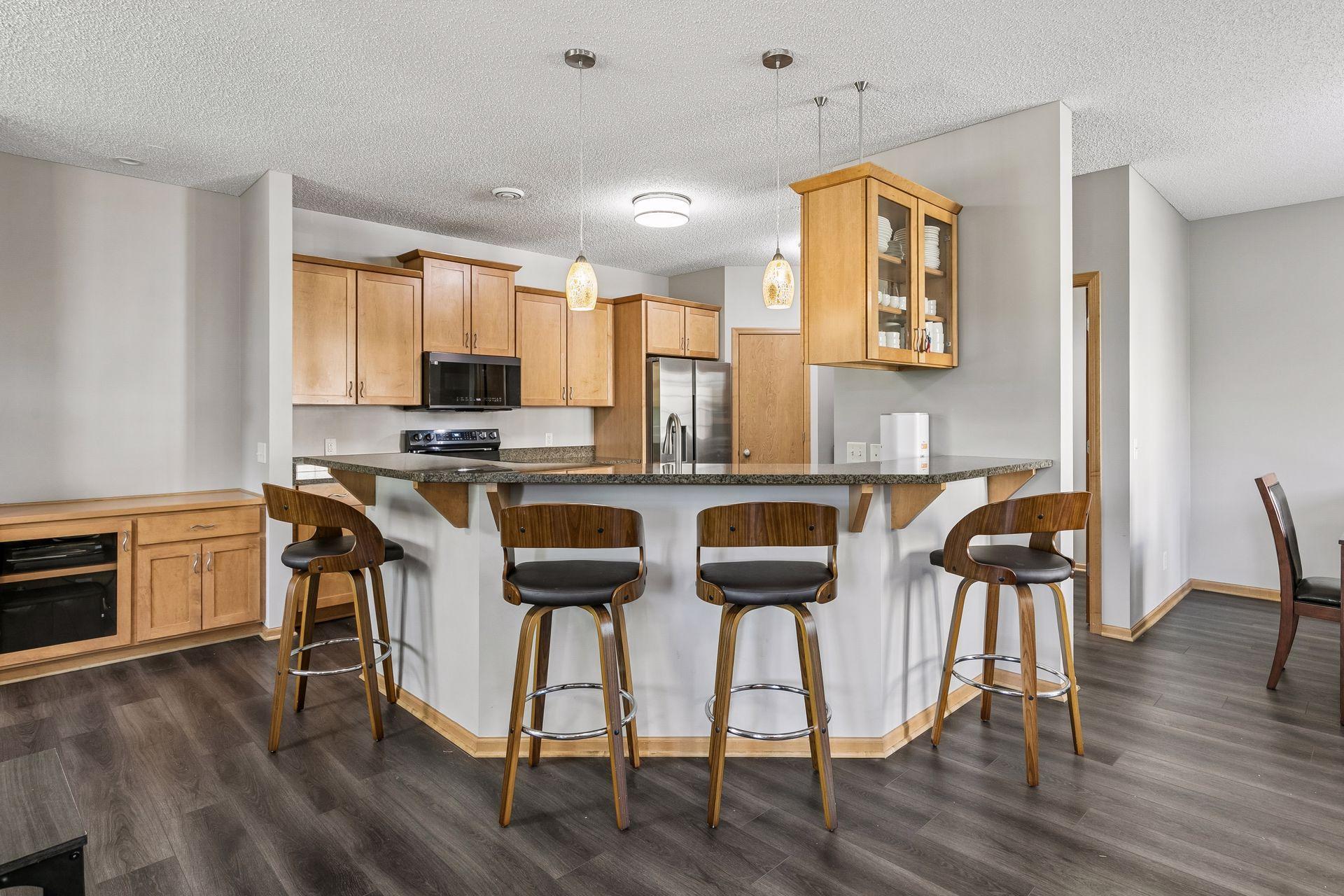 Kitchen counter seating area which is nice for meals!