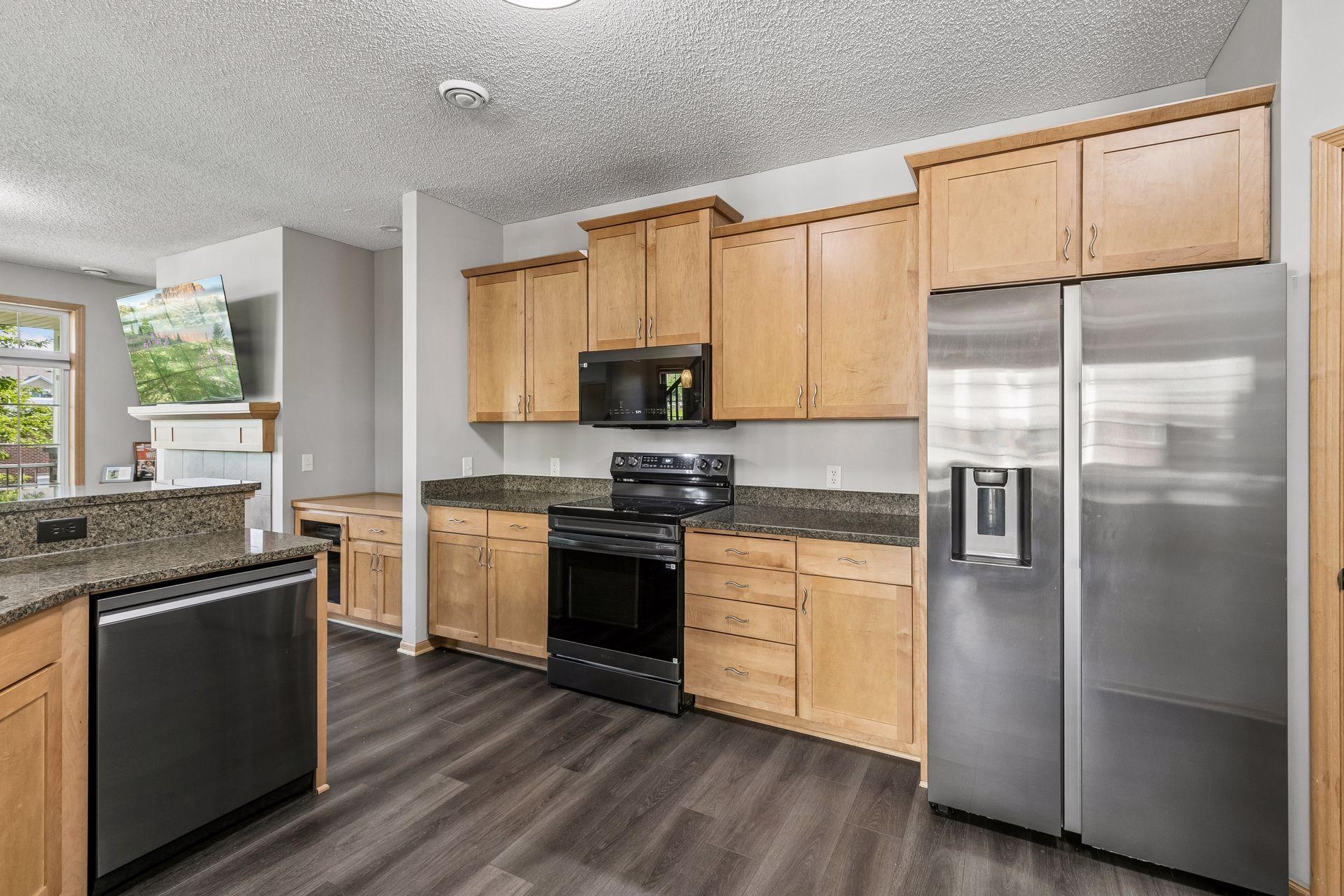 Cute kitchen counter space and stainless steel appliances.