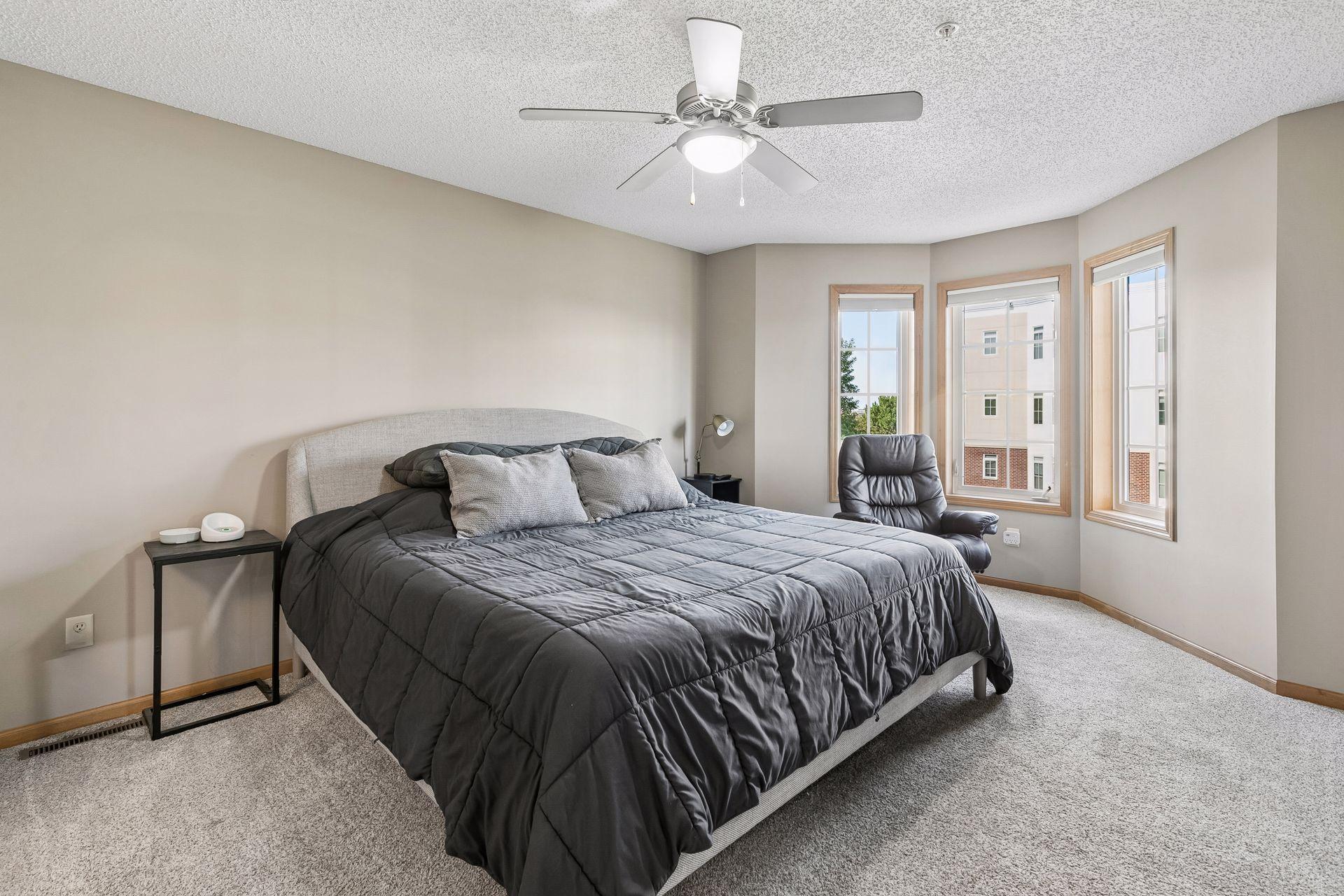 Bedroom that is very spacious and boasted with natural sunlight.