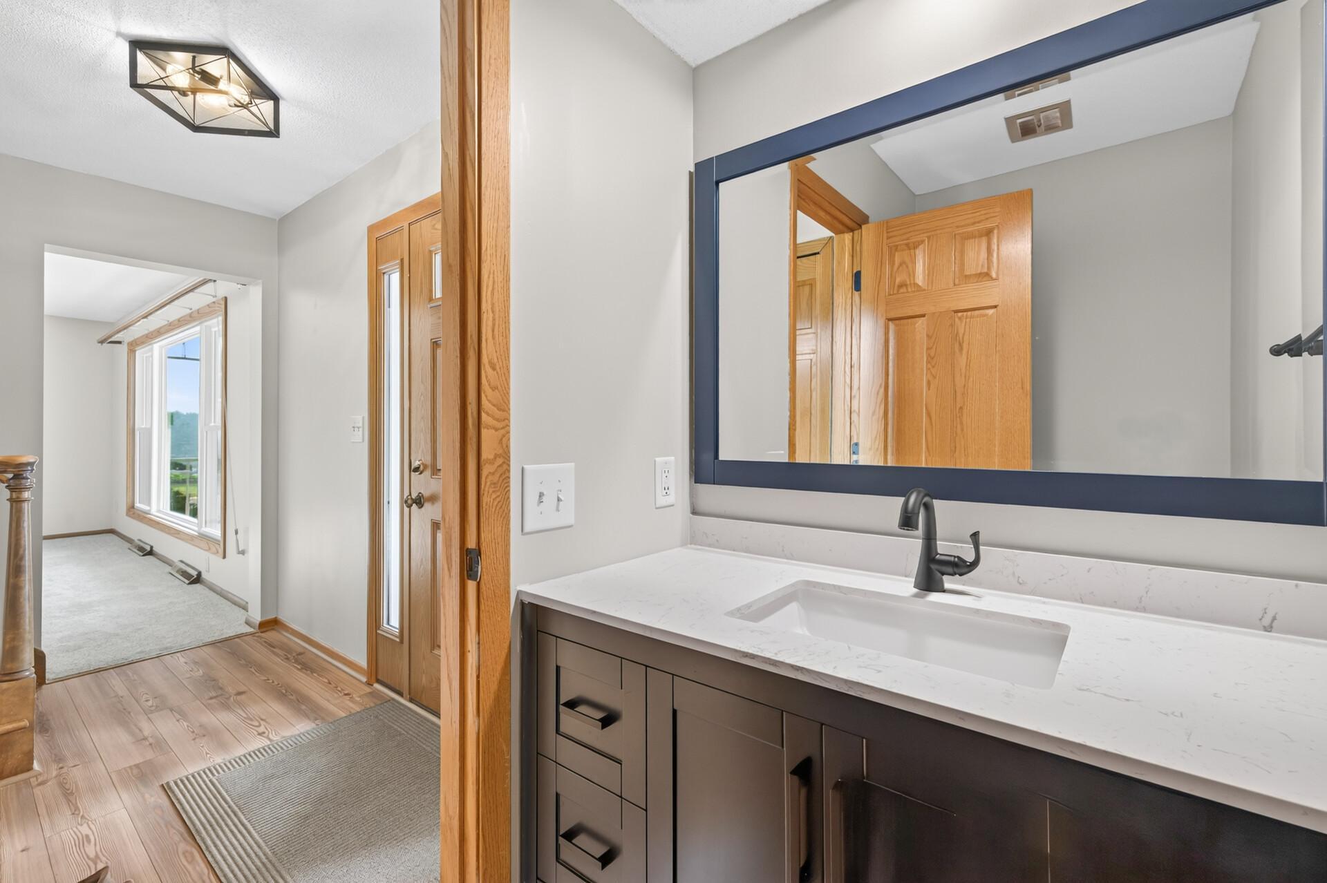 Updated main level bathroom with new vanity, sink and faucet!