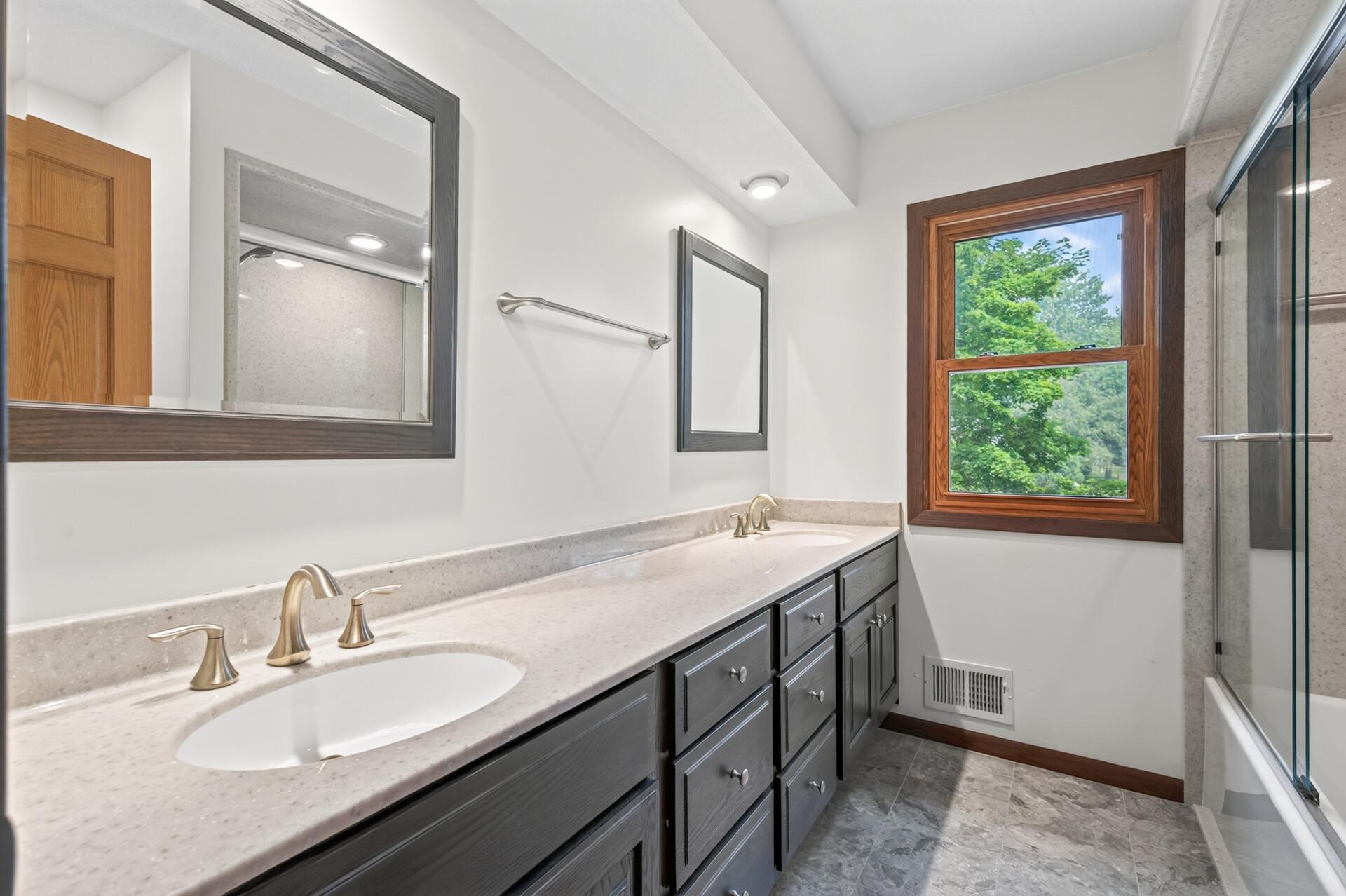 Recently updated full bathroom with double sinks and luxury vinyl flooring!