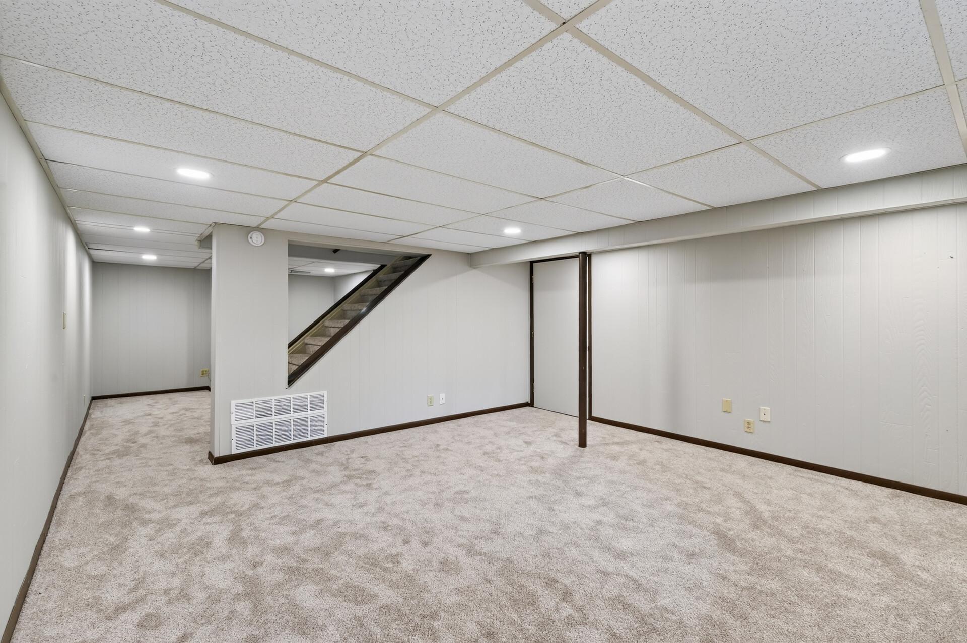 Lower level amusement room with new carpeting and fresh paint!