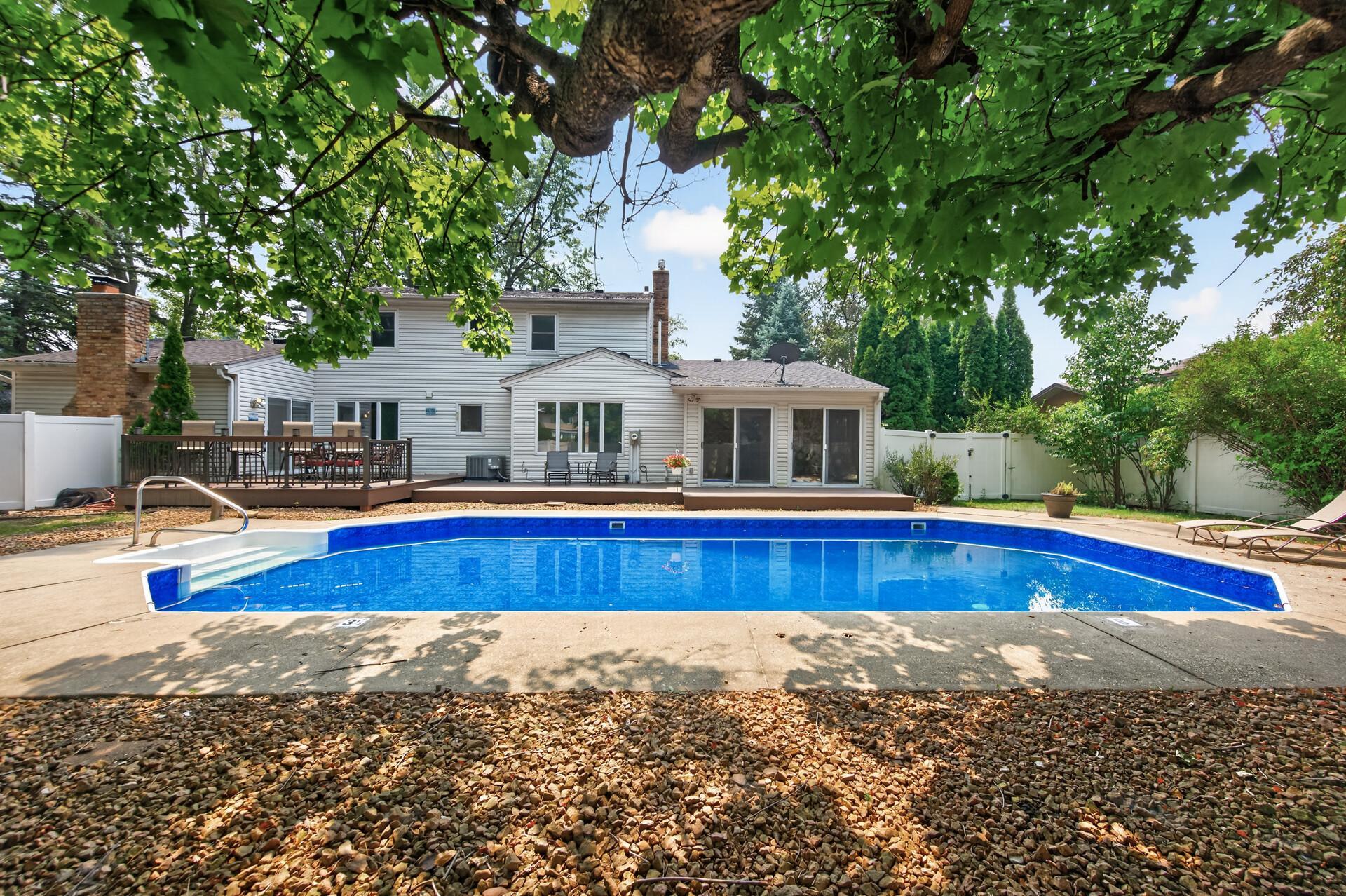Incredible backyard pool that's surrounded by patio's and composite decking!