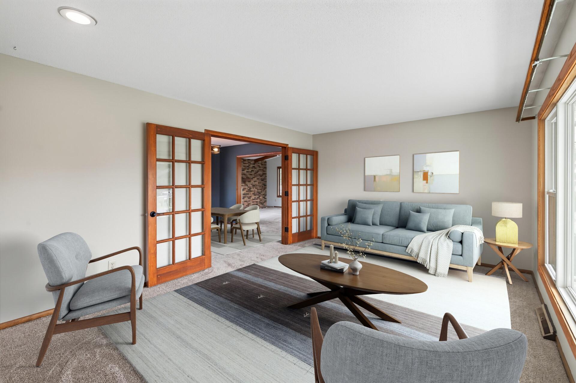 Main level living room with new carpeting and fresh paint (virtual furniture).