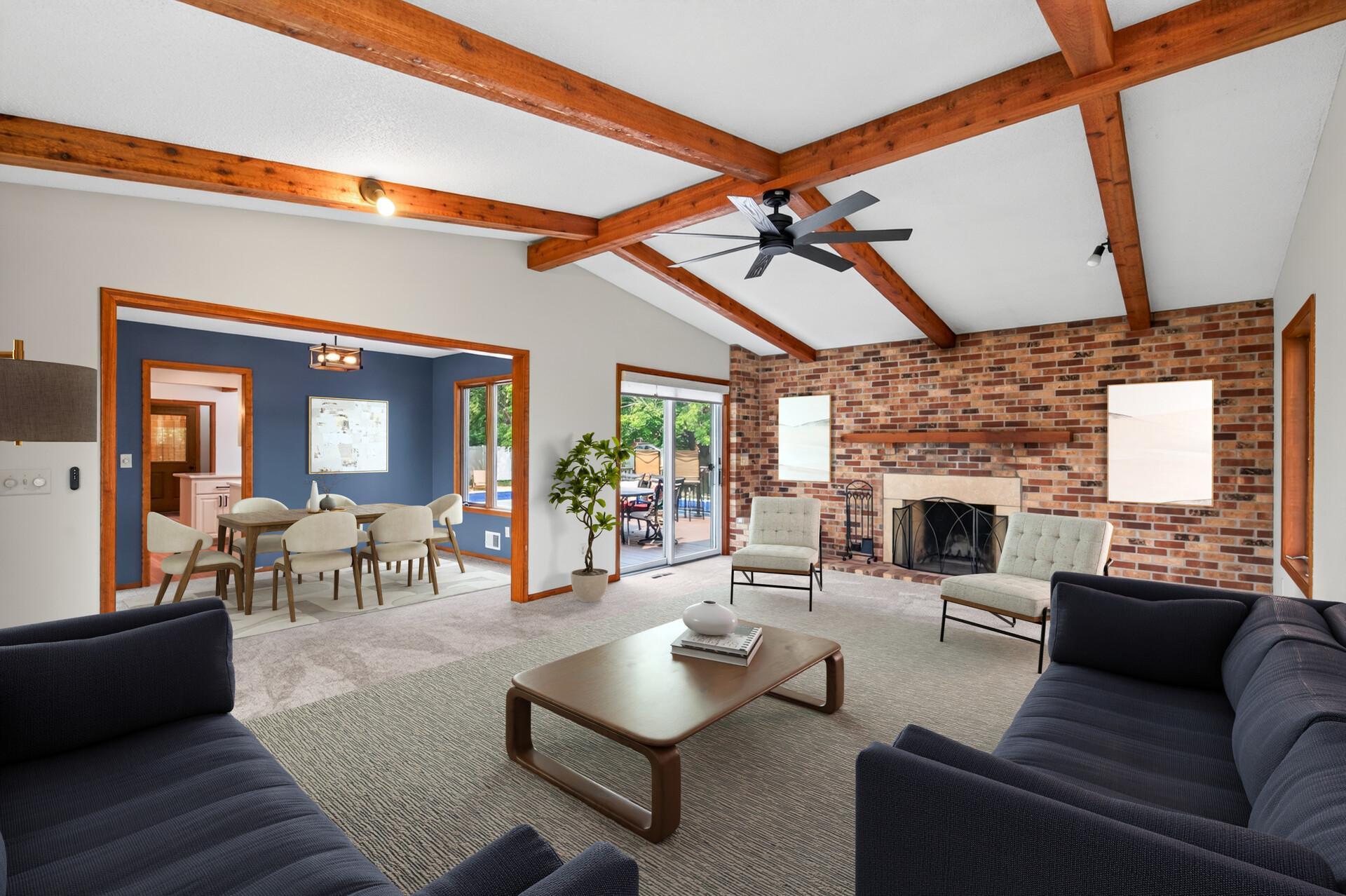 Spacious family room/great room that adjoins the living room and dining room with direct access to the amazing backyard and inground pool (virtual furniture).