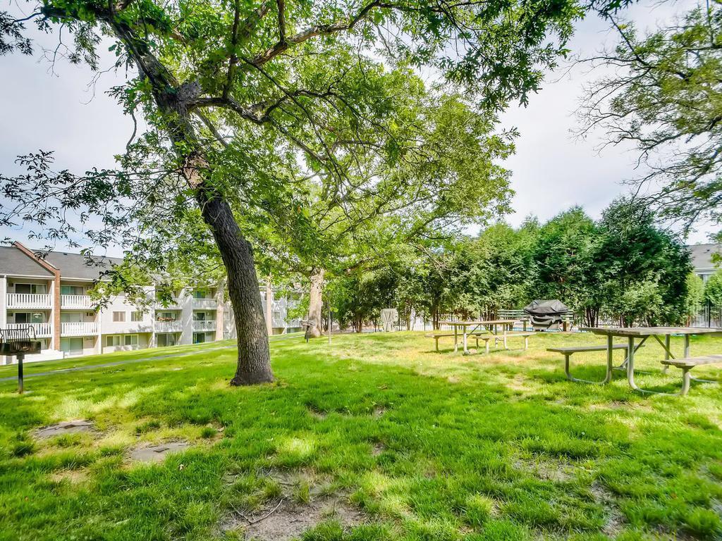 There are picnic tables and grills next to the pool for residents use.
