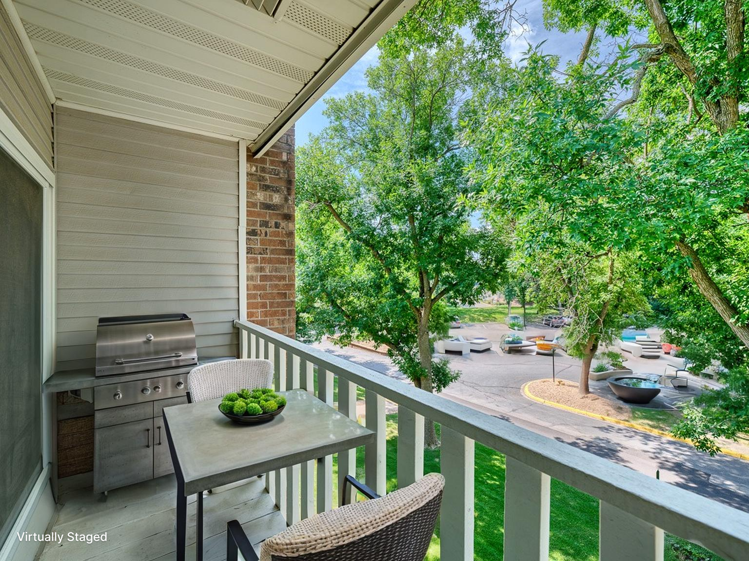 Enjoy your morning coffee and a great read from the building's library on your own private balcony. Virtually staged photo.