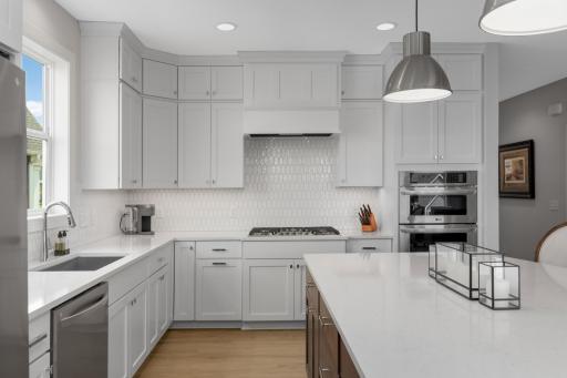 Full height cabinets and a large walk in pantry right around the corner offer ample storage space.