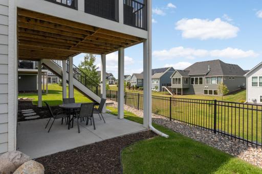 Lower level patio under the screen porch offers protection from rain.