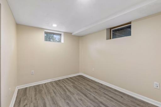 Lower level den/office - add an egress window for a 5th bedroom.