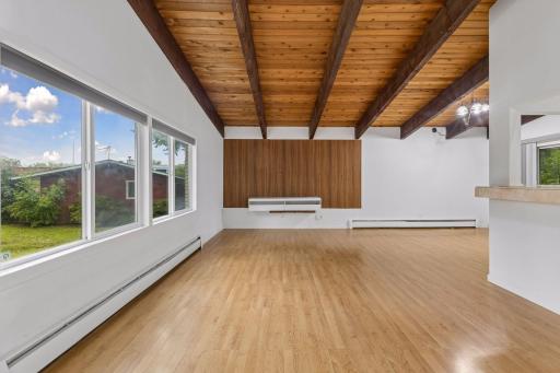 Absolutely stunning cedar tongue and groove vaulted ceiling with wood beams.