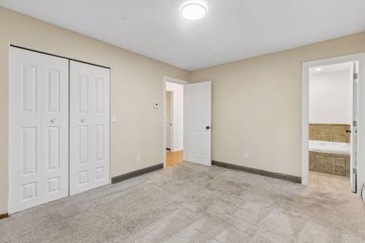 Primary bedroom provides a walk-thru to the full bath.