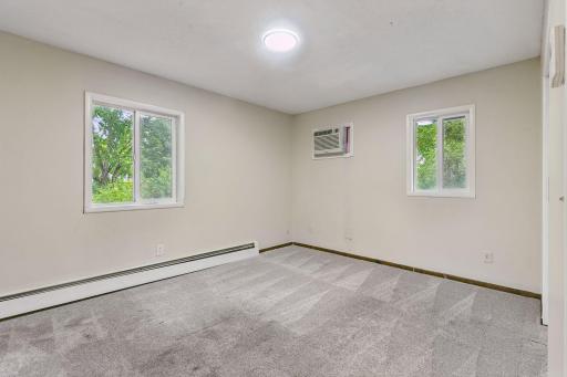 Three bedrooms located in the top level with a full bath.