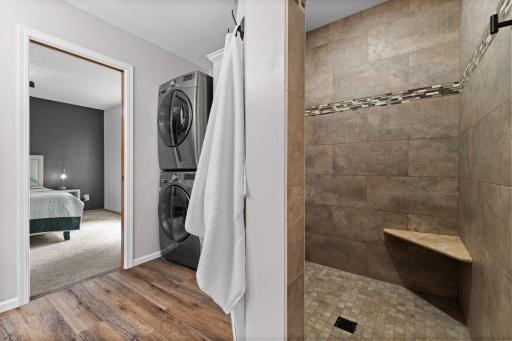 The primary bath is a 3/4 with custom tile shower and you will find the washer and dryer also on the upper. Location makes laundry a breeze!