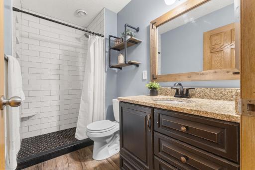 Lower level 3/4 bath with custom tile shower