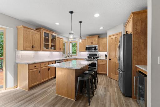 New granite countertops and new tile backsplash in 2025. Enjoy breakfast right in the kitchen!