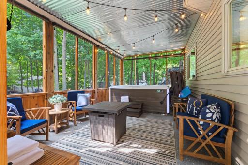 This screened in porch will soon become your favorite outdoor space. Hot tub is available for purchase.