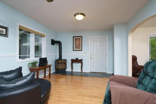 1st Floor Family Room with gas log stove, door opens to newer 2 car garage