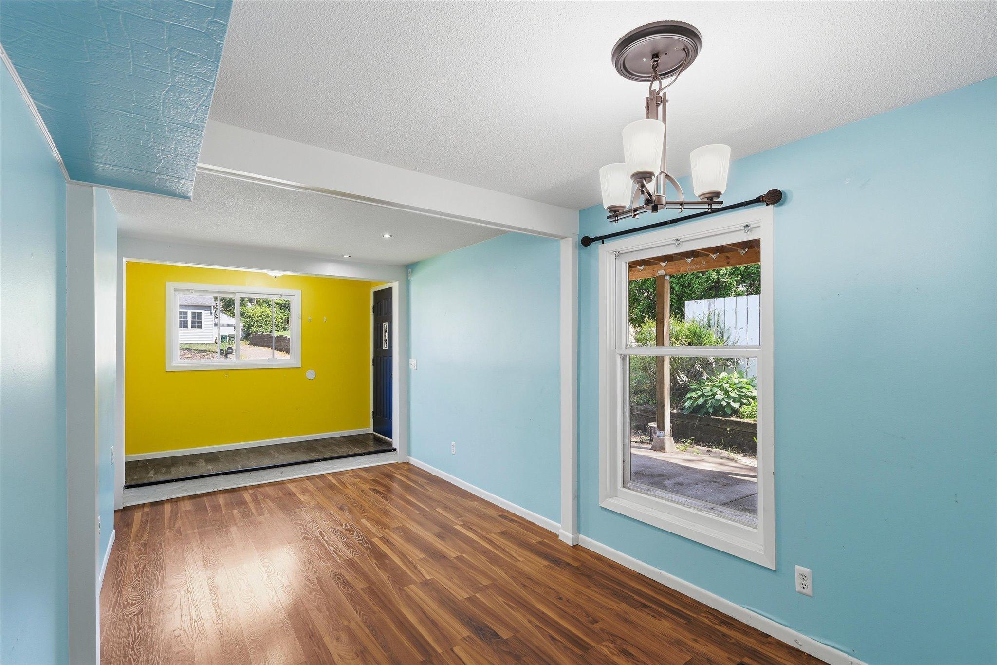 Open space flows from foyer, living room to dining area, makes for easy entertaining