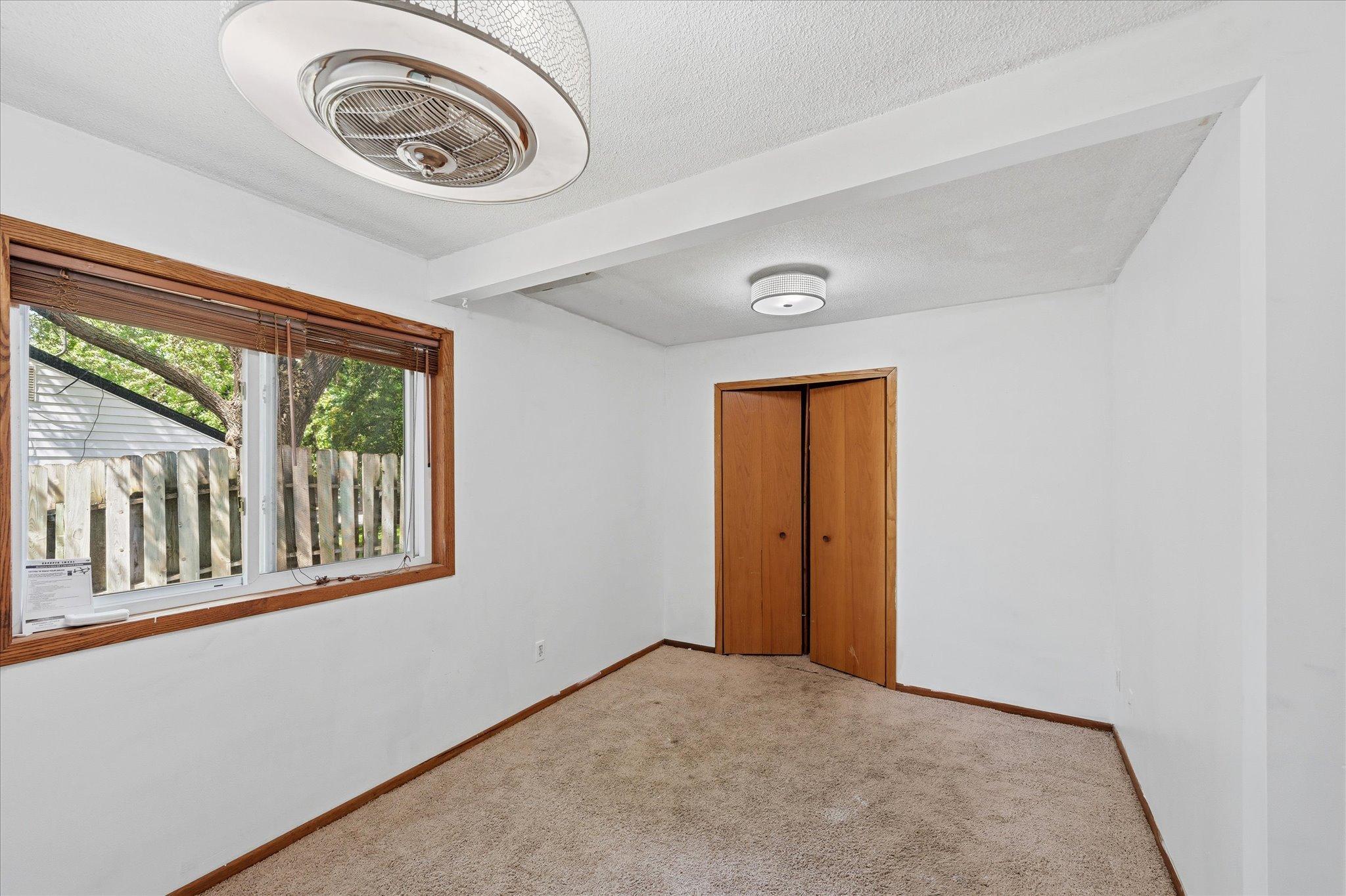 Main level bedroom with closet