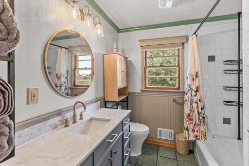 A full bathroom ohe main level with a new vanity and lighting!