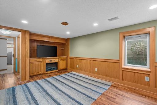 The family room has built-ins and a gas fireplace.