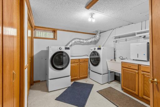 The laundry room has excellent storage and space!