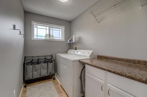 Simplify your laundry day with the convenience of an upper-level laundry space