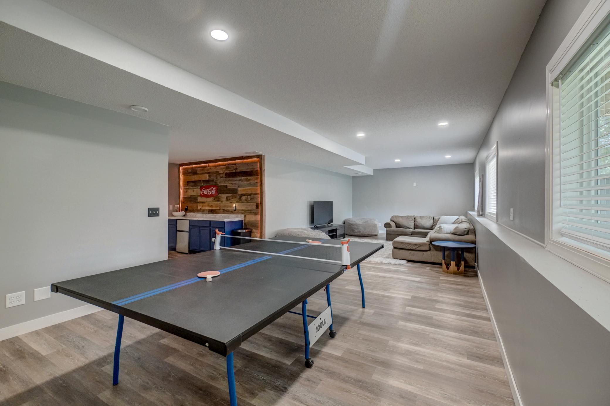 The lower-level family room provides flexible living space for game nights, guests, hobbies, and more