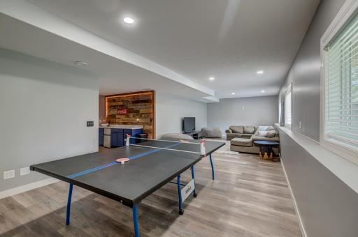 The lower-level family room provides flexible living space for game nights, guests, hobbies, and more