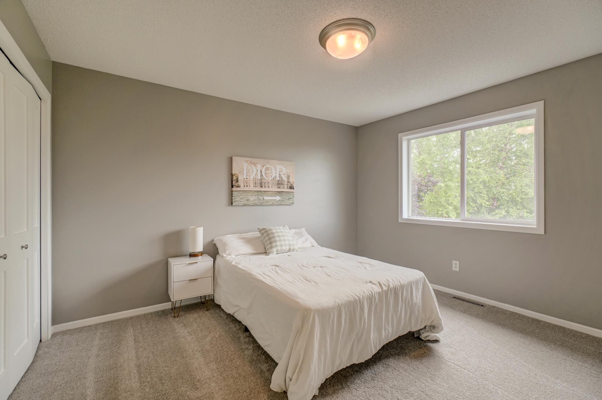Bright and inviting third upper-level bedroom