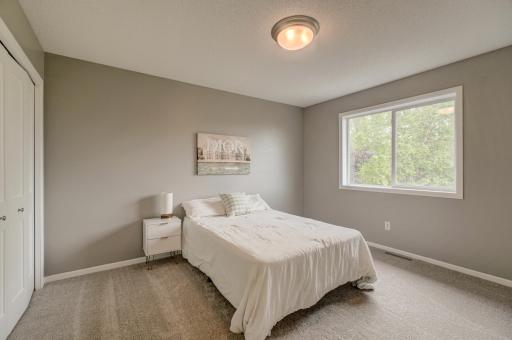 Bright and inviting third upper-level bedroom
