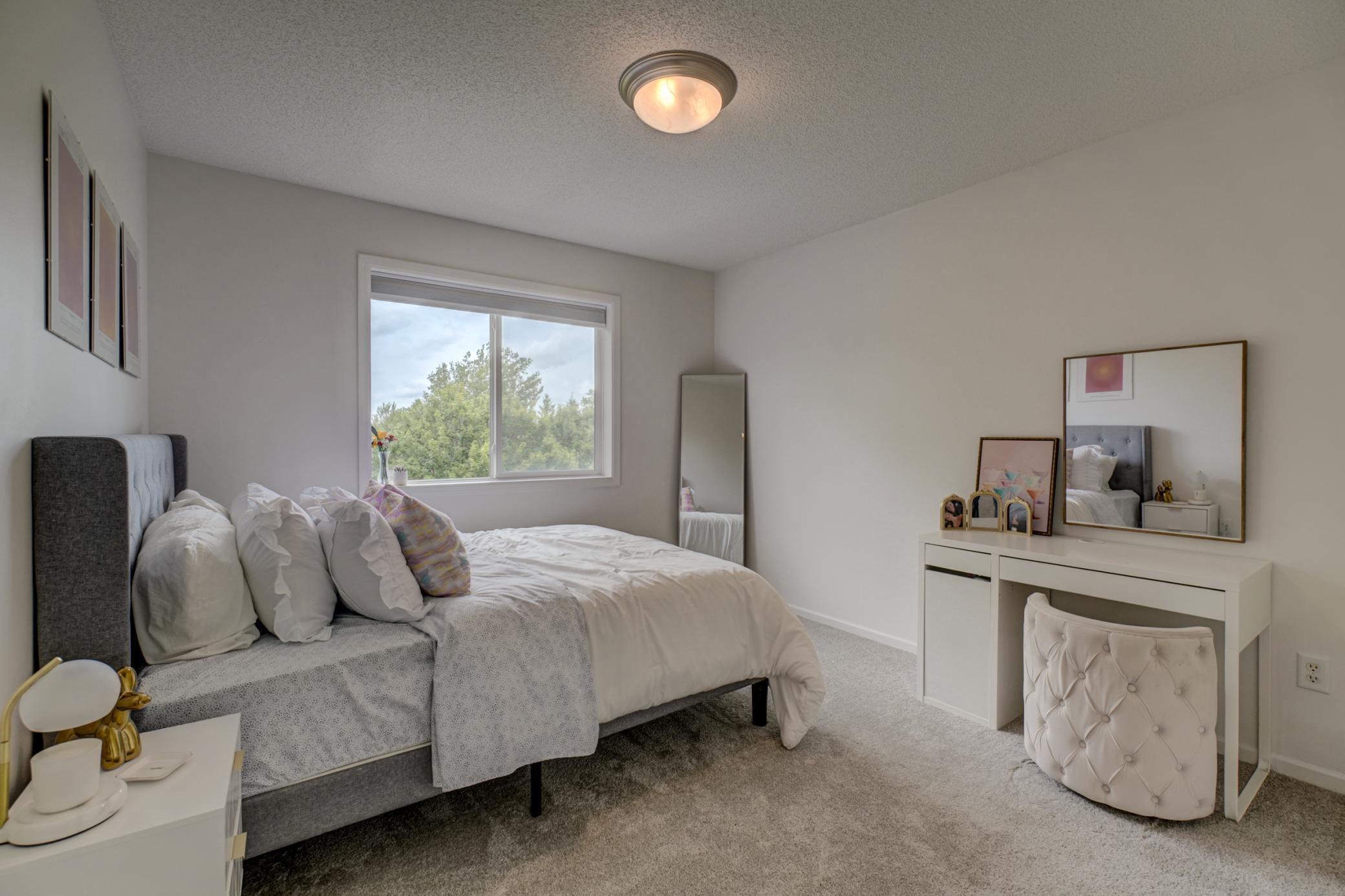 Bright and spacious secondary bedroom with generous closet space!