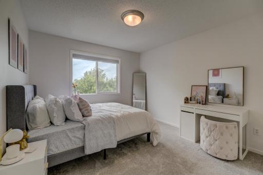 Bright and spacious secondary bedroom with generous closet space!