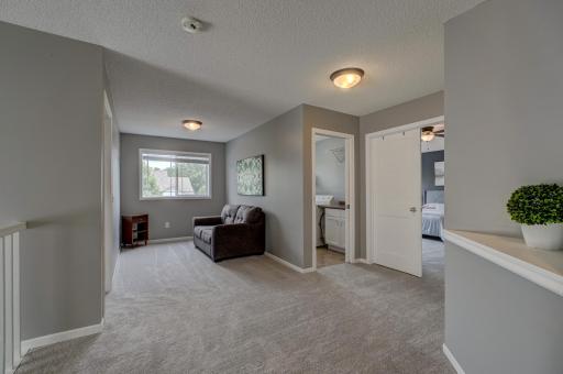 The versatile upper-level loft is ideal for a home office, playroom, reading nook, or additional living space