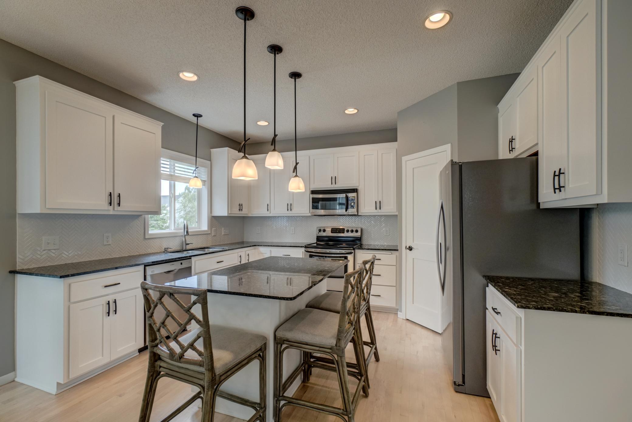 Gather, create, and entertain in this thoughtfully designed kitchen with a spacious layout and timeless appeal!