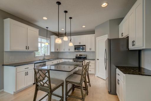 Gather, create, and entertain in this thoughtfully designed kitchen with a spacious layout and timeless appeal!