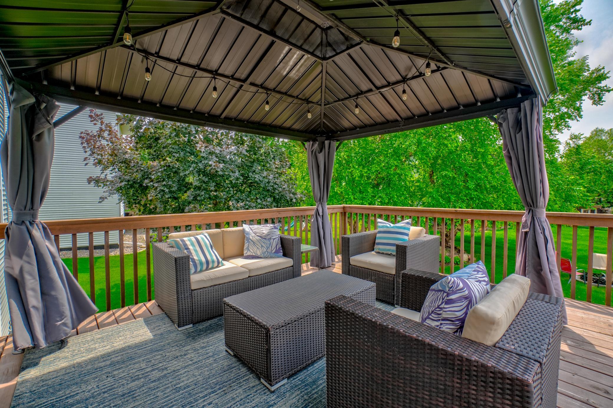 Relax under the gazebo that overlooks the spacious backyard perfect for year-round enjoyment!