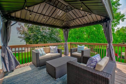 Relax under the gazebo that overlooks the spacious backyard perfect for year-round enjoyment!