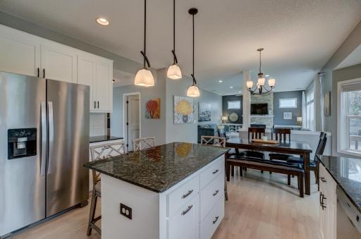 Generous pantry and an oversized center island provide plenty of prep space for gathering, entertaining, and keeping your kitchen organized and clutter-free!