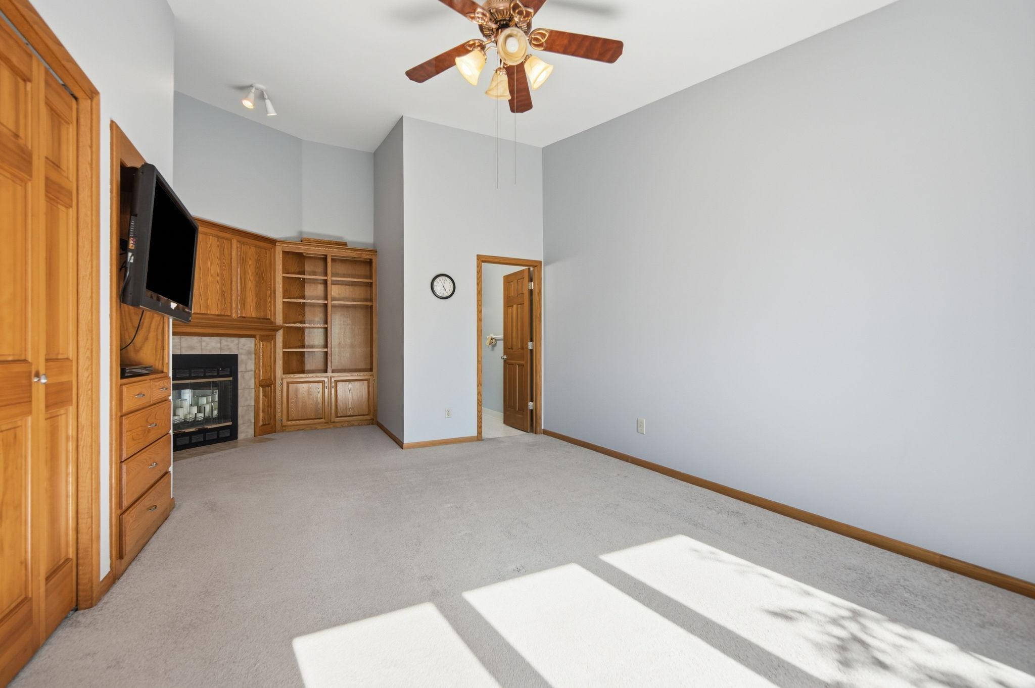 Vaulted ceilings elevate the owner's suite, creating a bright, open retreat that truly feels like your own private oasis.