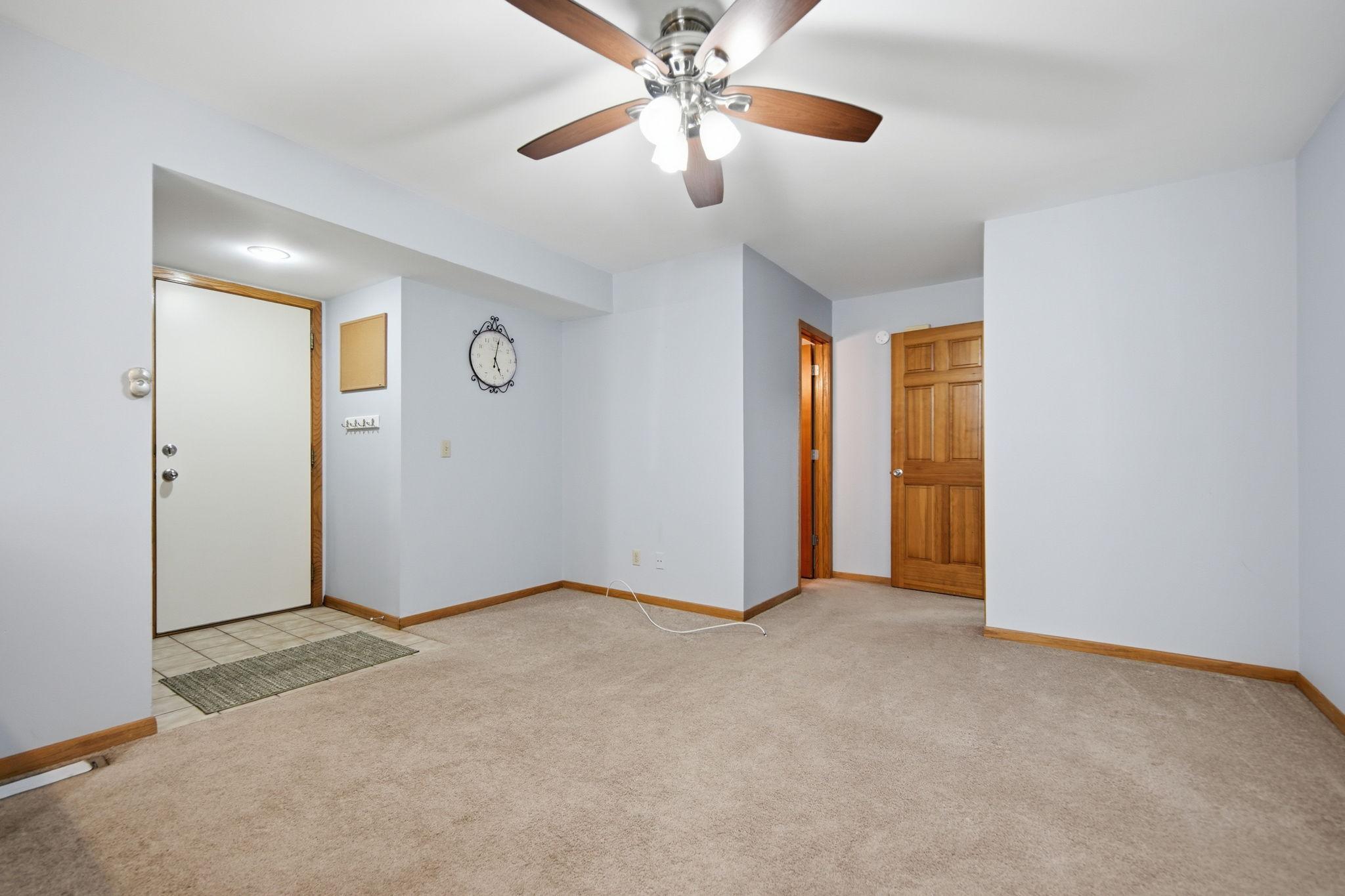 Around the corner, the lower level offers additional flexible living space.