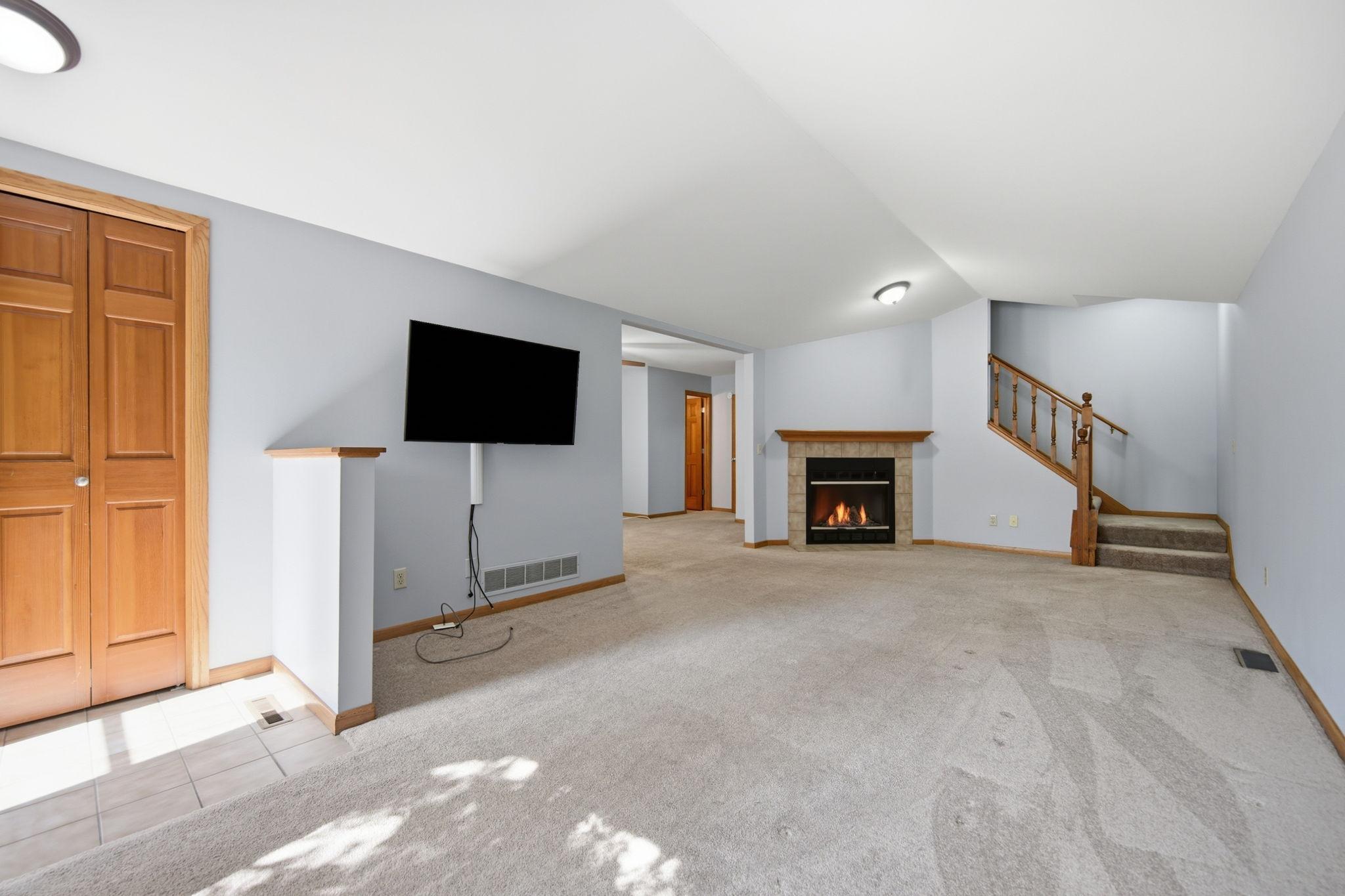 Main level family room with fireplace awaits...